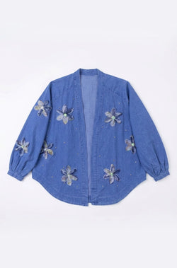 Blue denim jacket with floral embellishments on a white background